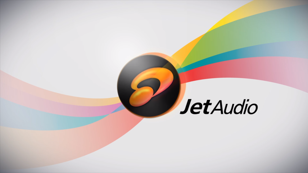 A Logo With The Name &Quot;Jetaudio Plus&Quot; On The Right Side In Black Text. The Logo Features A Sleek Orange And Yellow Design Within A Black Circle. The Background Shows Colorful, Flowing Ribbons In Blue, Green, Yellow, Orange, Red, And Pink.